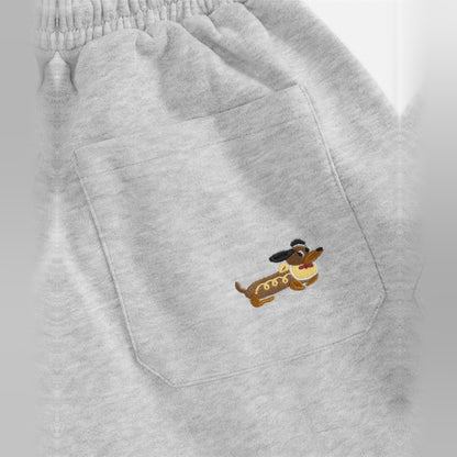 Close-up of the embroidered dog on the pocket