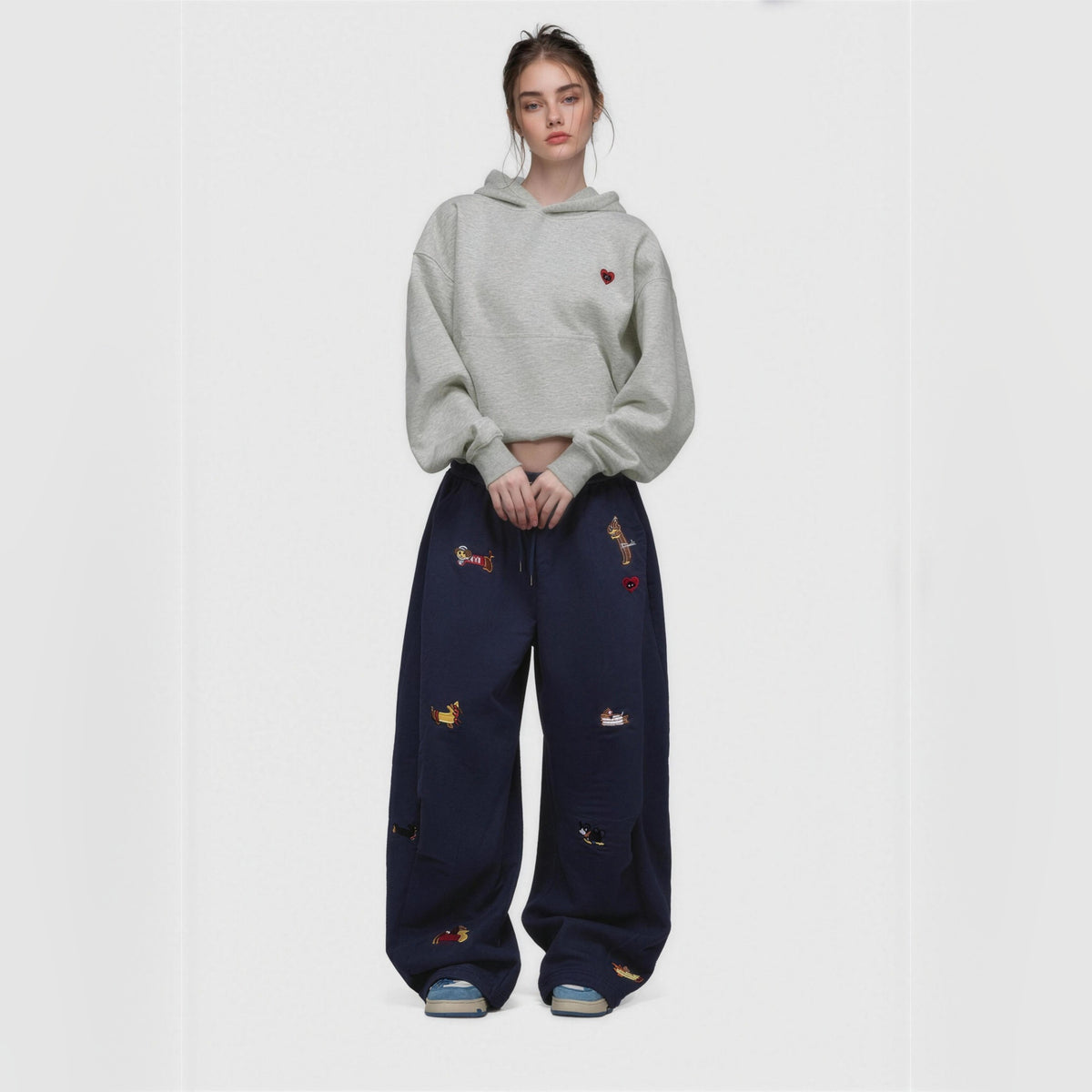 Amalia embroidered pup barrel sweatpants in navy blue, worn