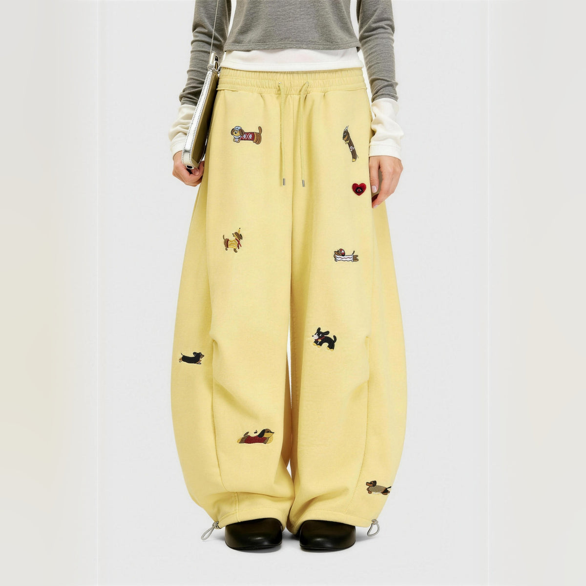 Amalia embroidered pup barrel sweatpants in yellow, worn front