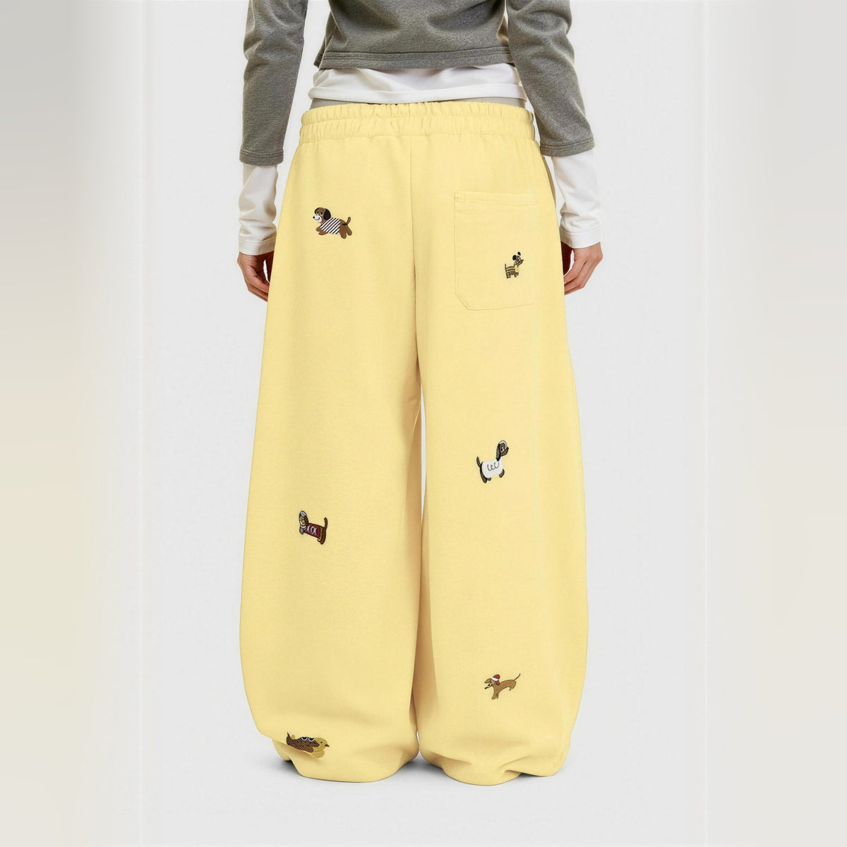 Amalia embroidered pup barrel sweatpants in yellow, worn back