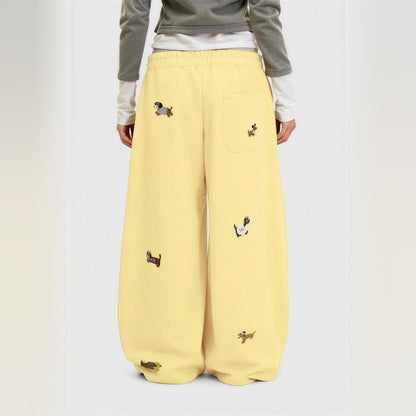 Amalia embroidered pup barrel sweatpants in yellow, worn back