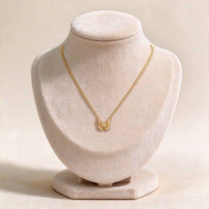 Aurelia gold butterfly necklace on a velvet jewellery bust