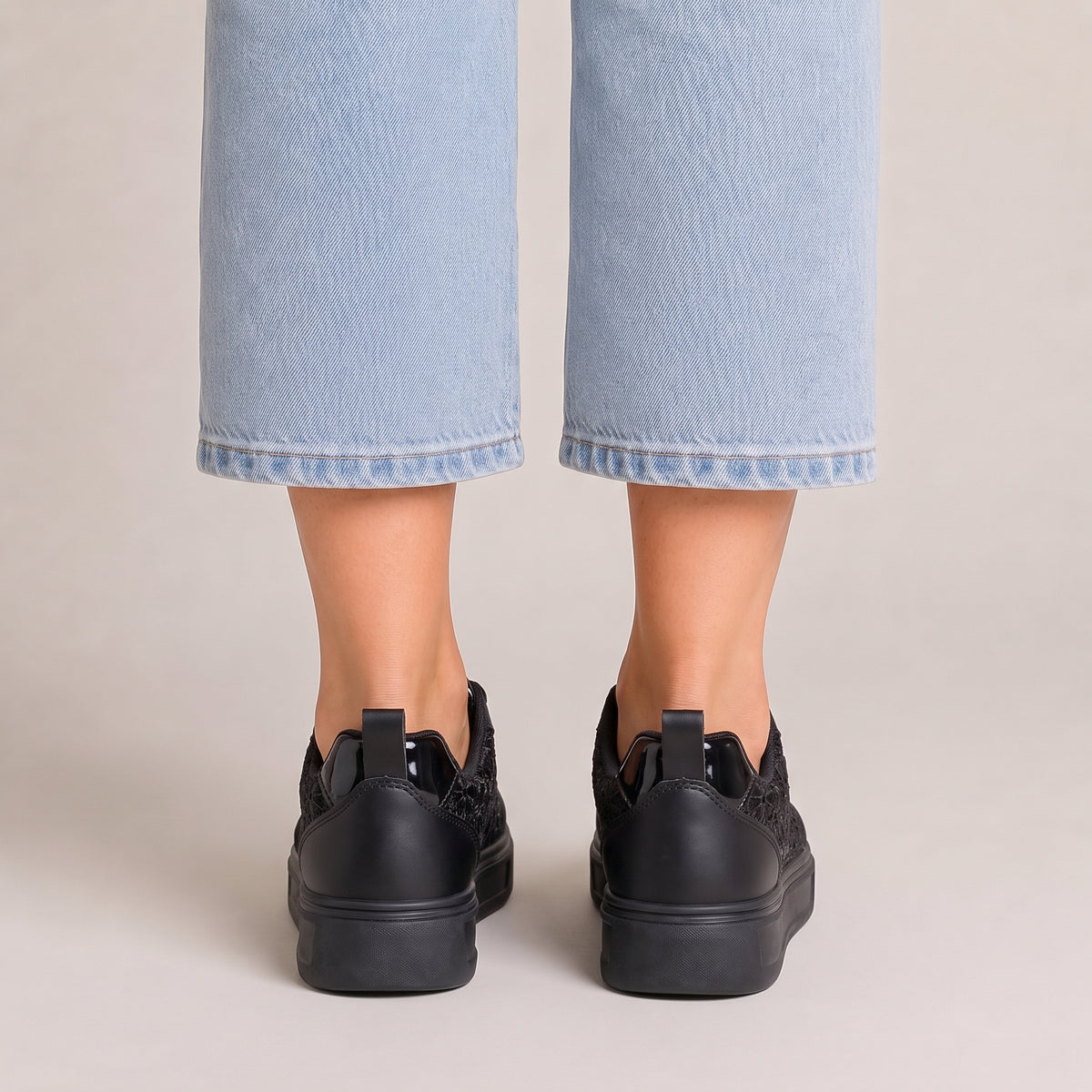 Clara floral lace trainers in black, back view