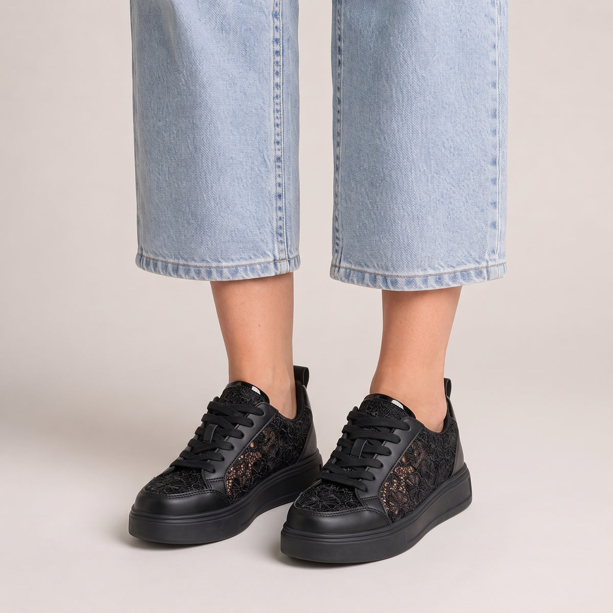 Clara floral lace trainers in black, front view