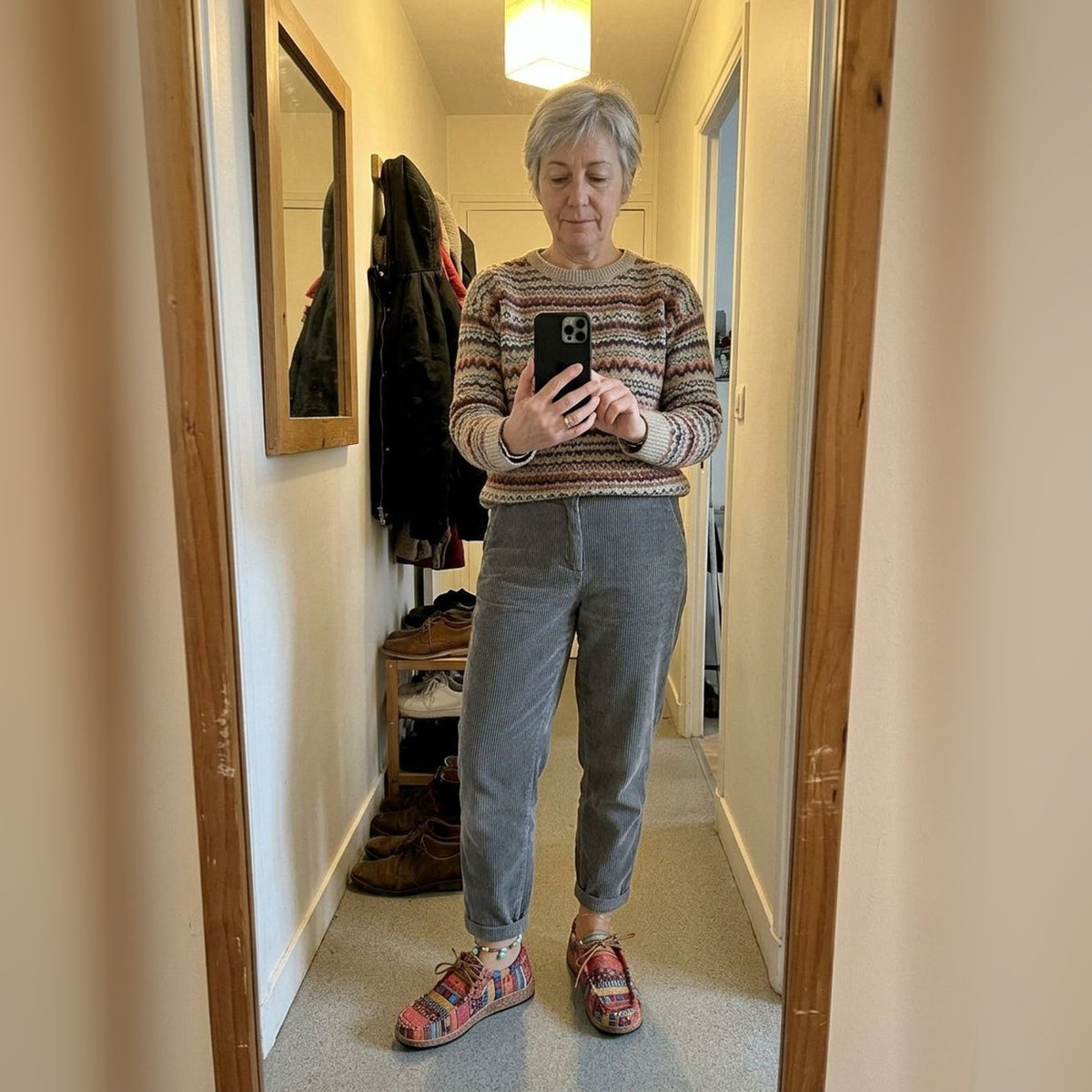 Evrey Boho Comfort Shoes in red worn with grey trousers