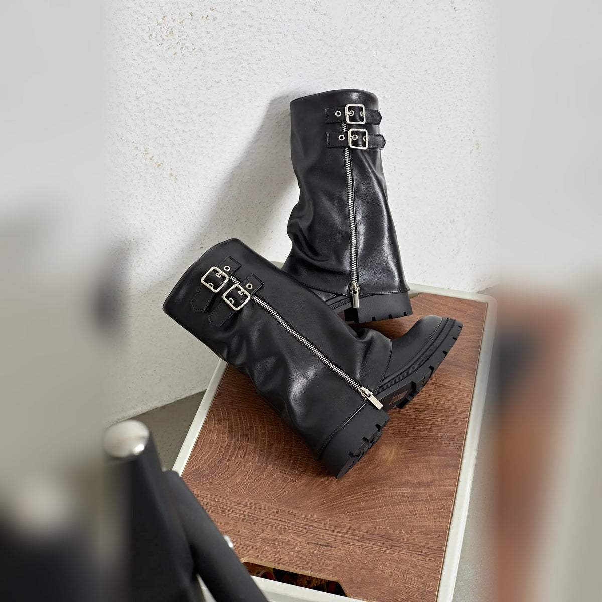 Evrey Zip Boots pair on a stool