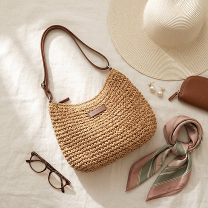 Sienna woven bag in beige with a straw hat and reading glasses