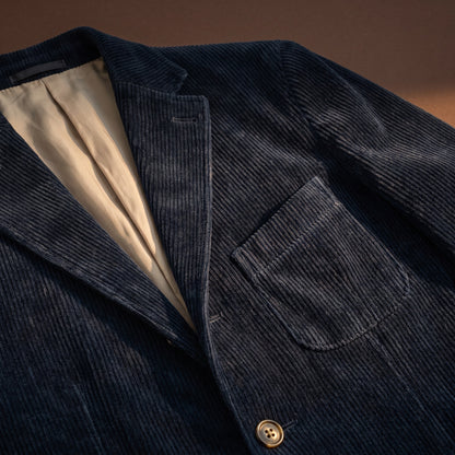 Blue corduroy fabric, flap pocket and lining detail
