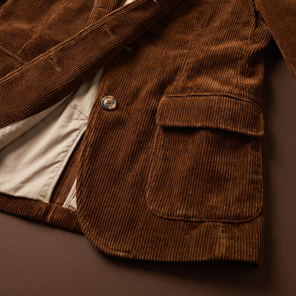 Brown corduroy fabric, flap pocket and lining detail