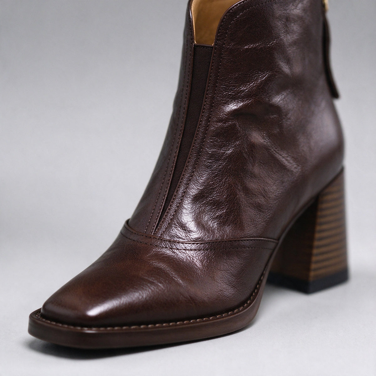 Livia brown ankle boot close-up of the squared toe and leather