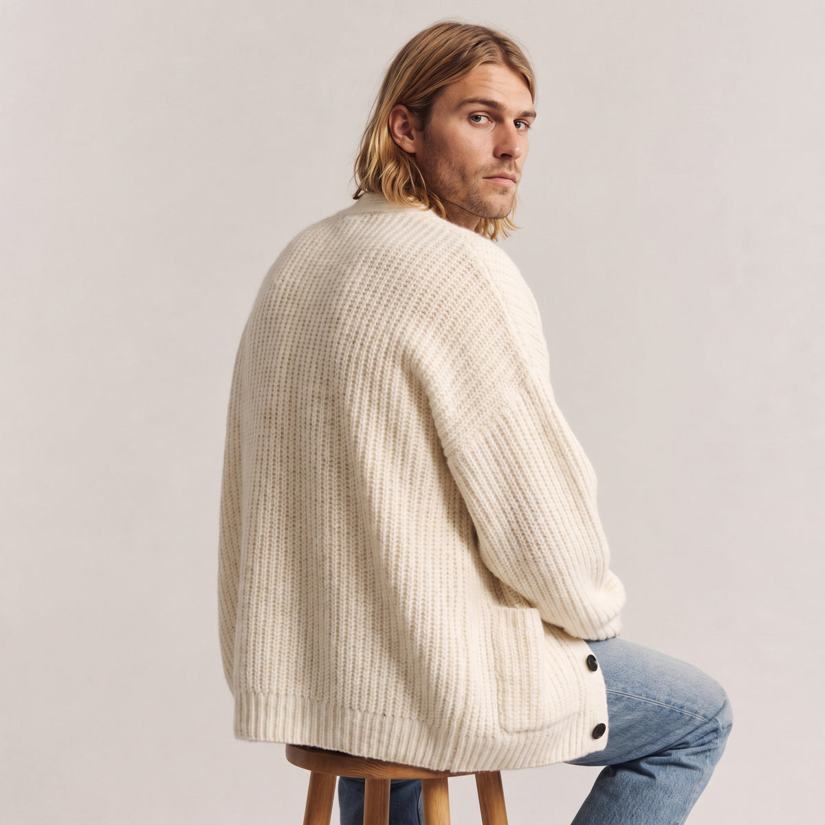 Nolan relaxed V-neck cardigan in apricot, worn