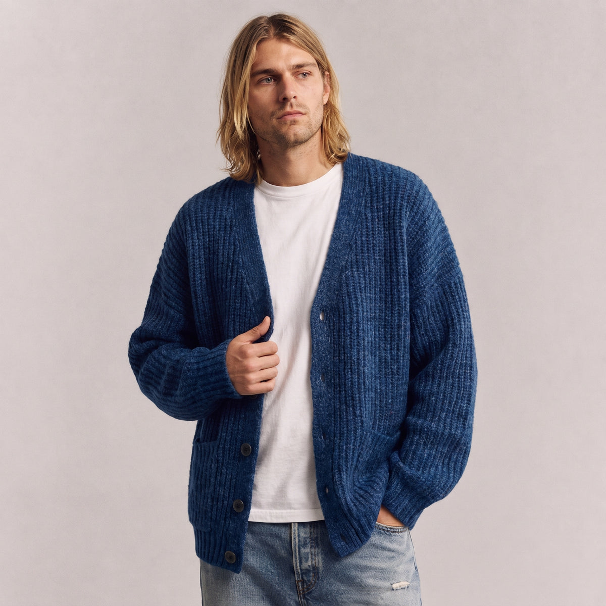 Nolan relaxed V-neck cardigan in blue, worn