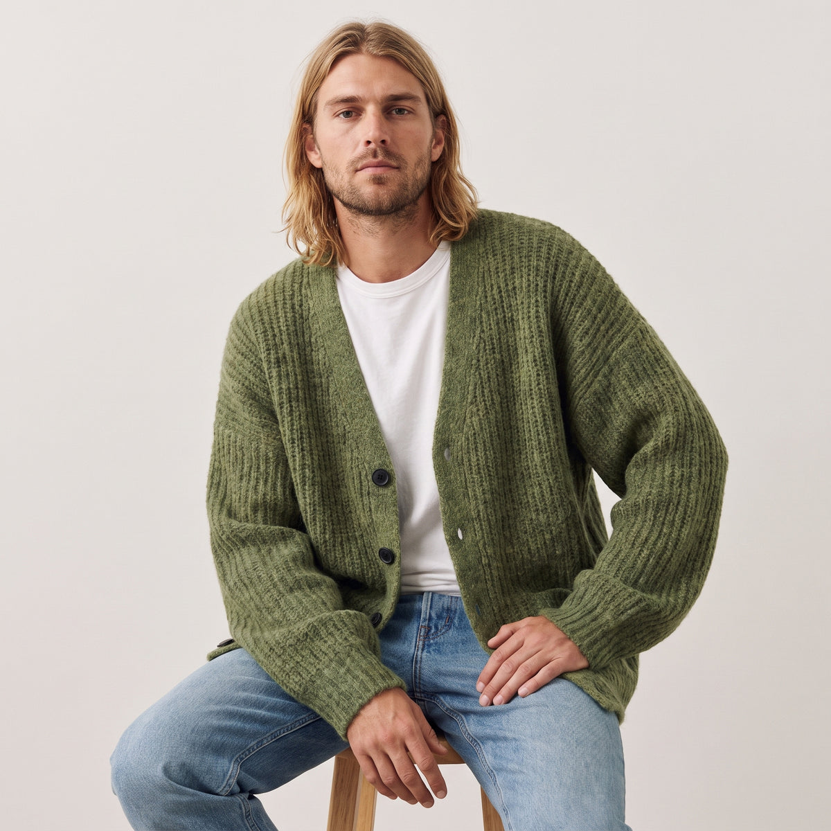 Nolan relaxed V-neck cardigan in green, worn