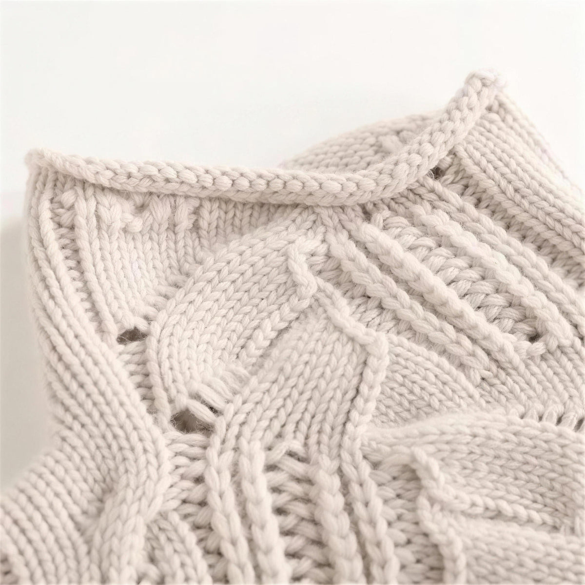 Oriana cable knit sweater in beige, rolled neck close-up