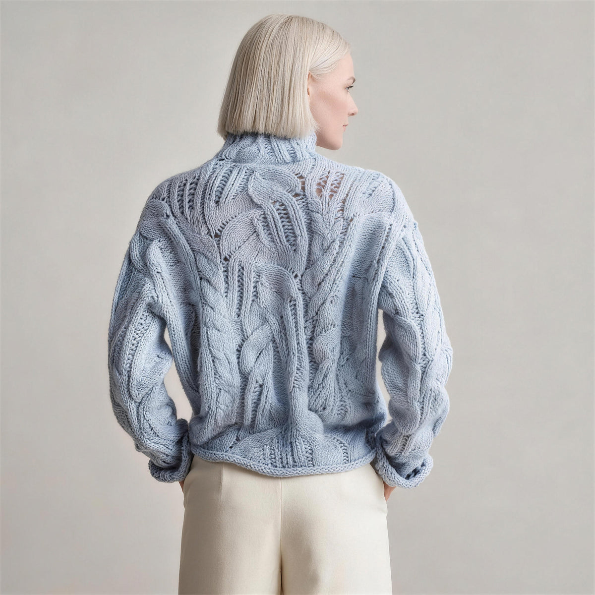 Oriana cable knit sweater in wavy blue, back view