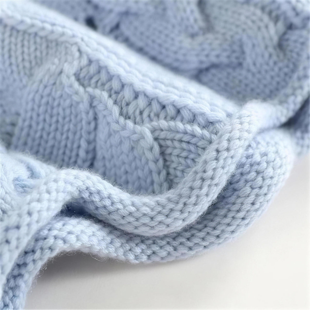 Oriana cable knit sweater in wavy blue, knit close-up