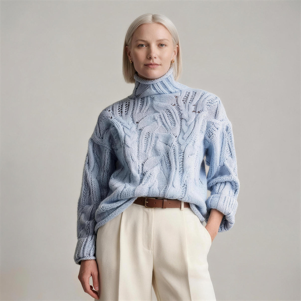 Oriana cable knit sweater in wavy blue, side view