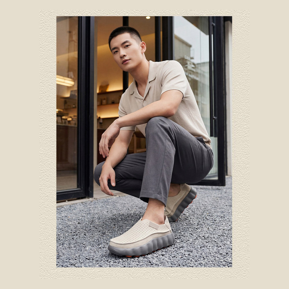 Ryden loafers in grey, crouching lifestyle shot