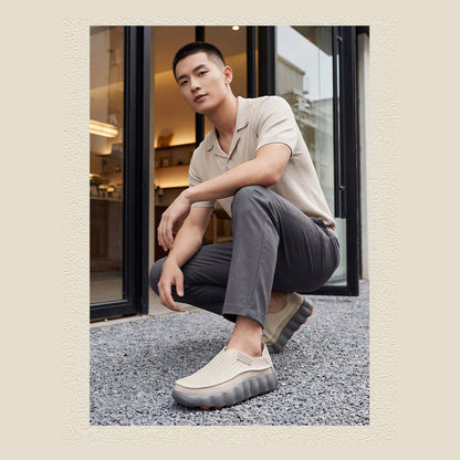 Ryden loafers in grey, crouching lifestyle shot