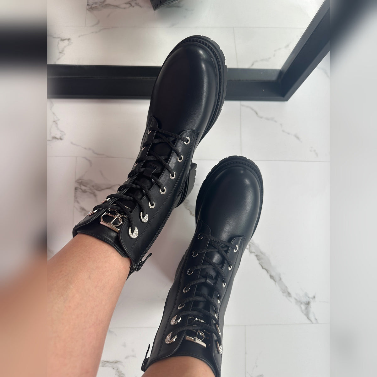 Sabina boots worn, lace-up front and silver-tone eyelets
