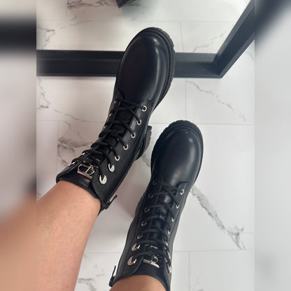 Sabina boots worn, lace-up front and silver-tone eyelets