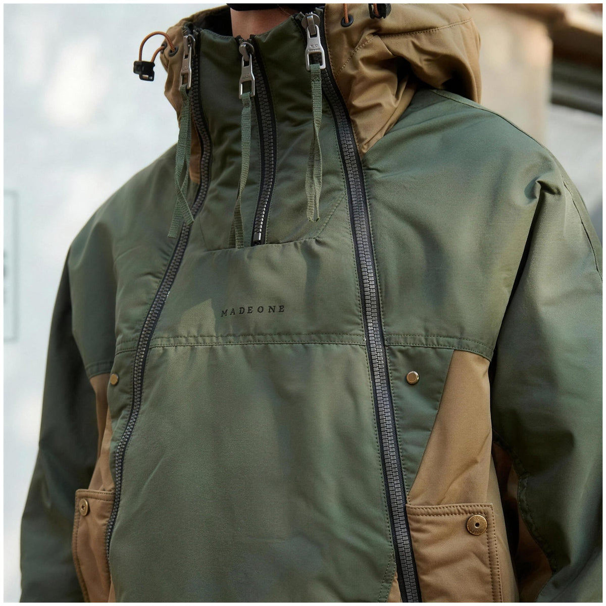 Close-up of the jacket worn, hood and chest detail